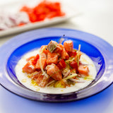 Salmon ceviche on a blue plate