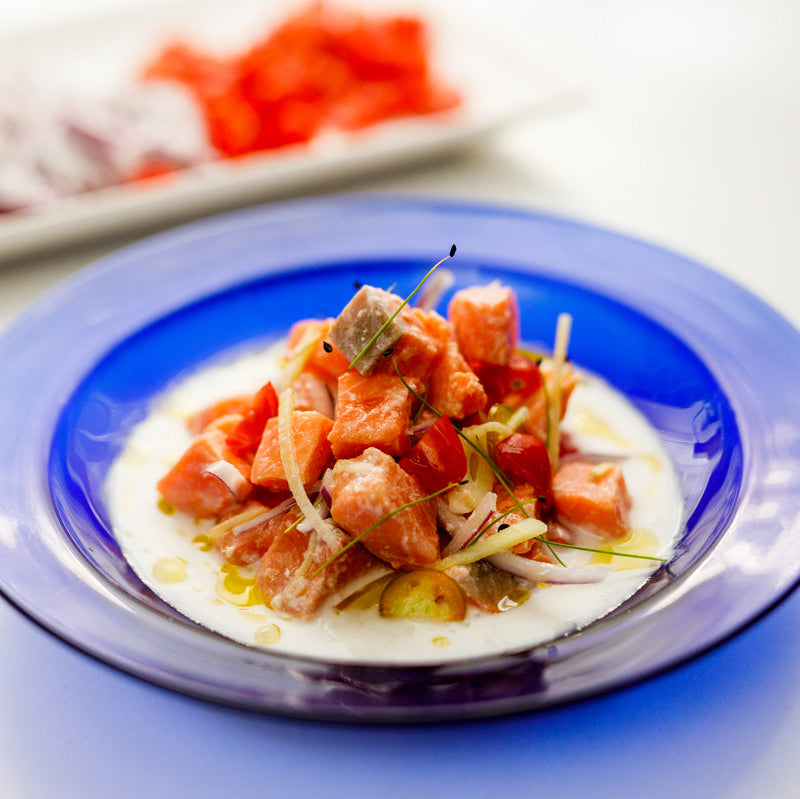 Salmon ceviche on a blue plate
